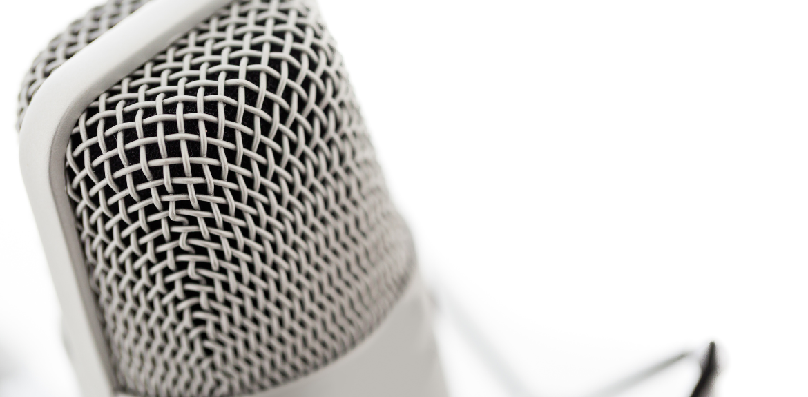 Close up of a microphone against a white background