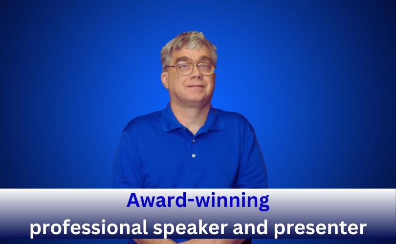 Centered against a vibrant dark blue background appears a photo of Chris Mitchell, wearing glasses and a blue polo shirt. Along the bottom of the image is a bar that transitions from white at the top to navy at the bottom. Inside this bar appears in bleu and white text “Award-winning professional speaker and presenter”